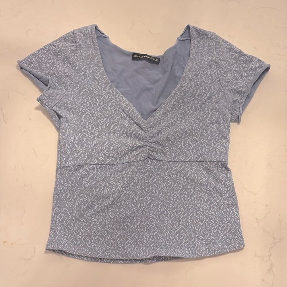 Brandy Melville—
old brandy blue and white flower t-shirt